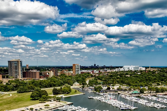 Milwaukee skyline with a blue sky and white clouds.